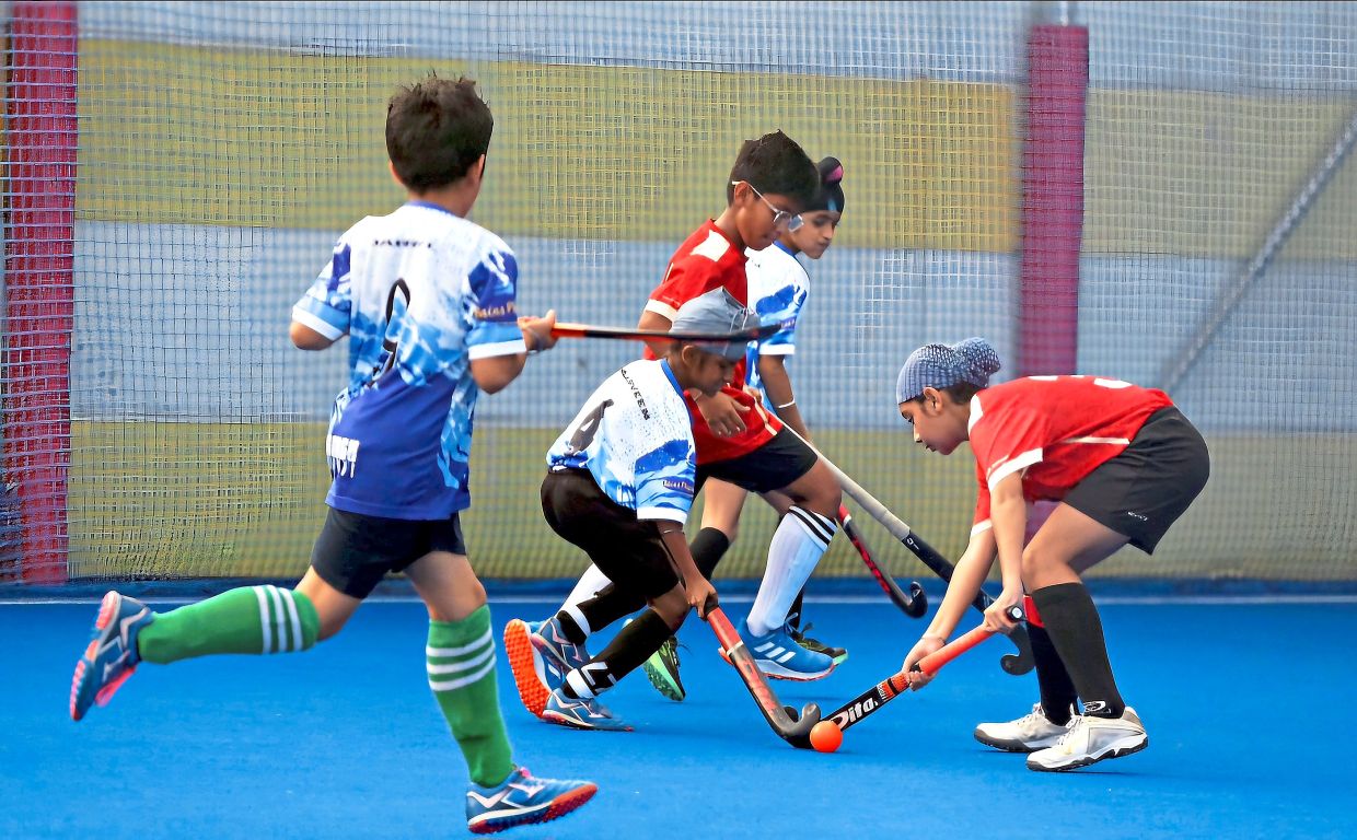 A hockey junior match underway at the Arena IRC in Bandar Seri Sendayan.
