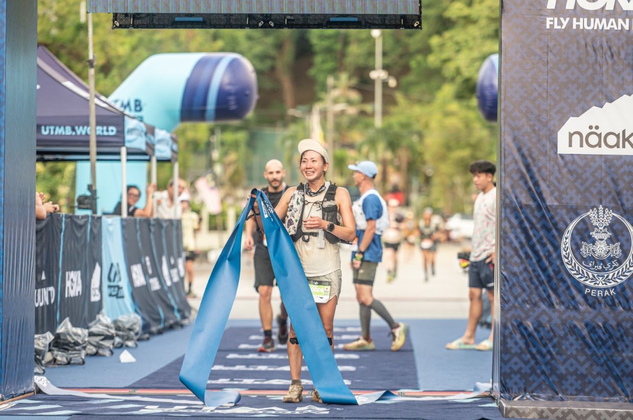 Malaysia’s Michelle Ng Qian Ying approaches the finish line to claim second place in the women’s MY50 at Malaysia Ultra-Trail by UTMB 2026 in Taiping.