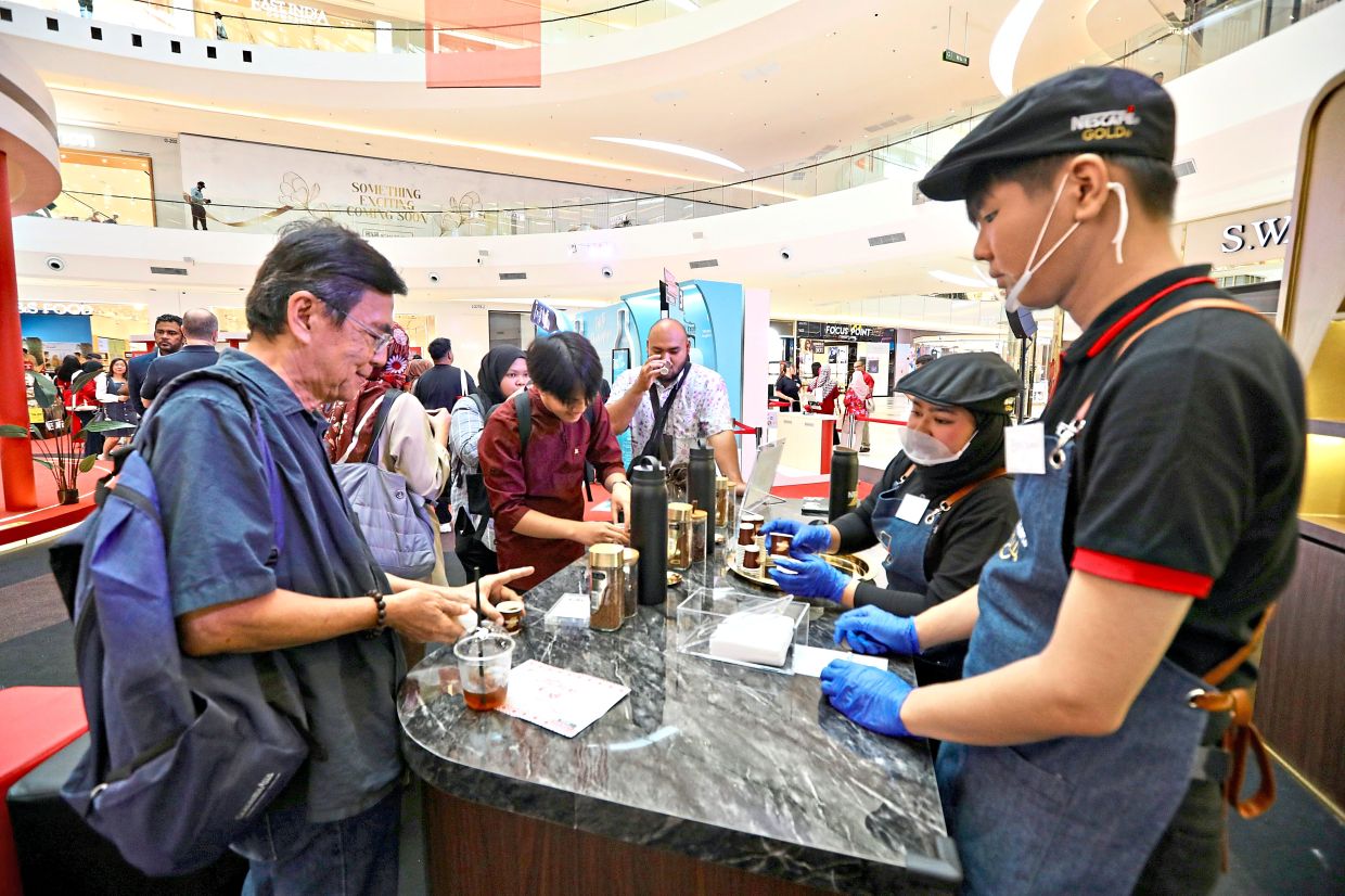 Attendees sampling the latest additions to the Nescafe beverage lineup at the tasting station. —Photos by LOW LAY PHON/The Star