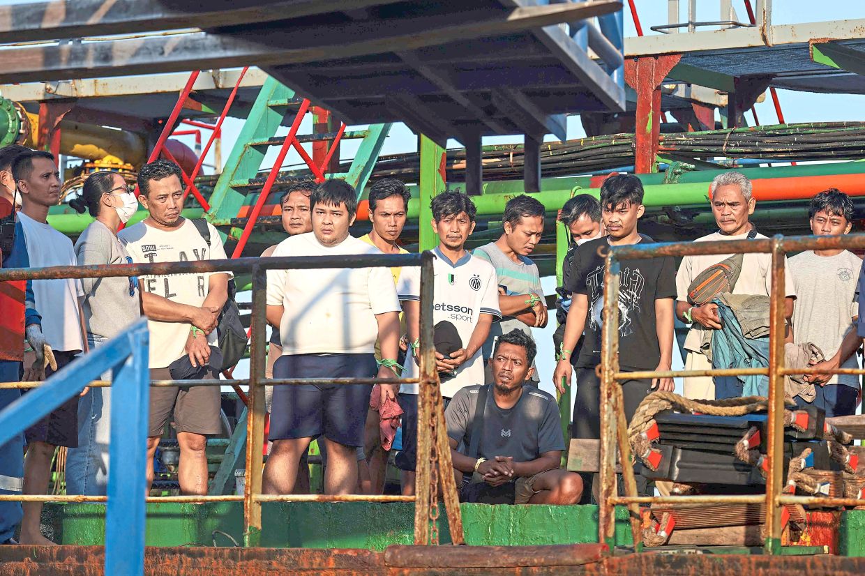 Narrow escape: Survivors of the ‘Virgo Transport 8’ passenger ferry wait to disembark at the port in Banjarmasin, South Kalimantan, after being rescued. — AFP