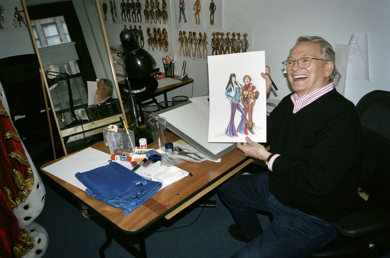 Bob Mackie holds a drawing of Sonny and Cher at his costume design studio in 2018. Photo: The New York Times