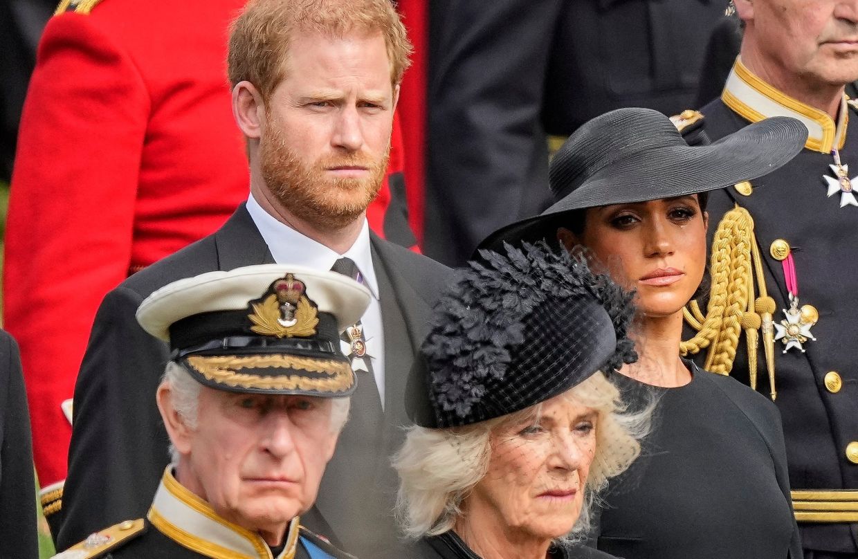 (From bottom left) Britain's King Charles III, Camilla, the Queen Consort, Prince Harry and Meghan, Duchess of Sussex watch as the coffin of Queen Elizabeth II is placed into the hearse following the state funeral service in Westminster Abbey in central London on Sept 19, 2022. Photo: AP