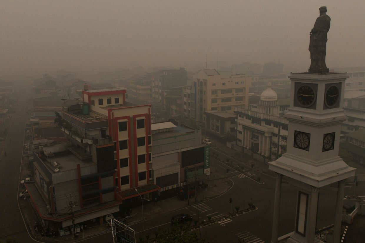 A drone view shows a statue of Saint Joseph at St. Joseph's Cathedral as the city is shrouded in haze from wildfires, in Pontianak, West Kalimantan province, Indonesia, Sept 15, 2026. - Photo: Reuters