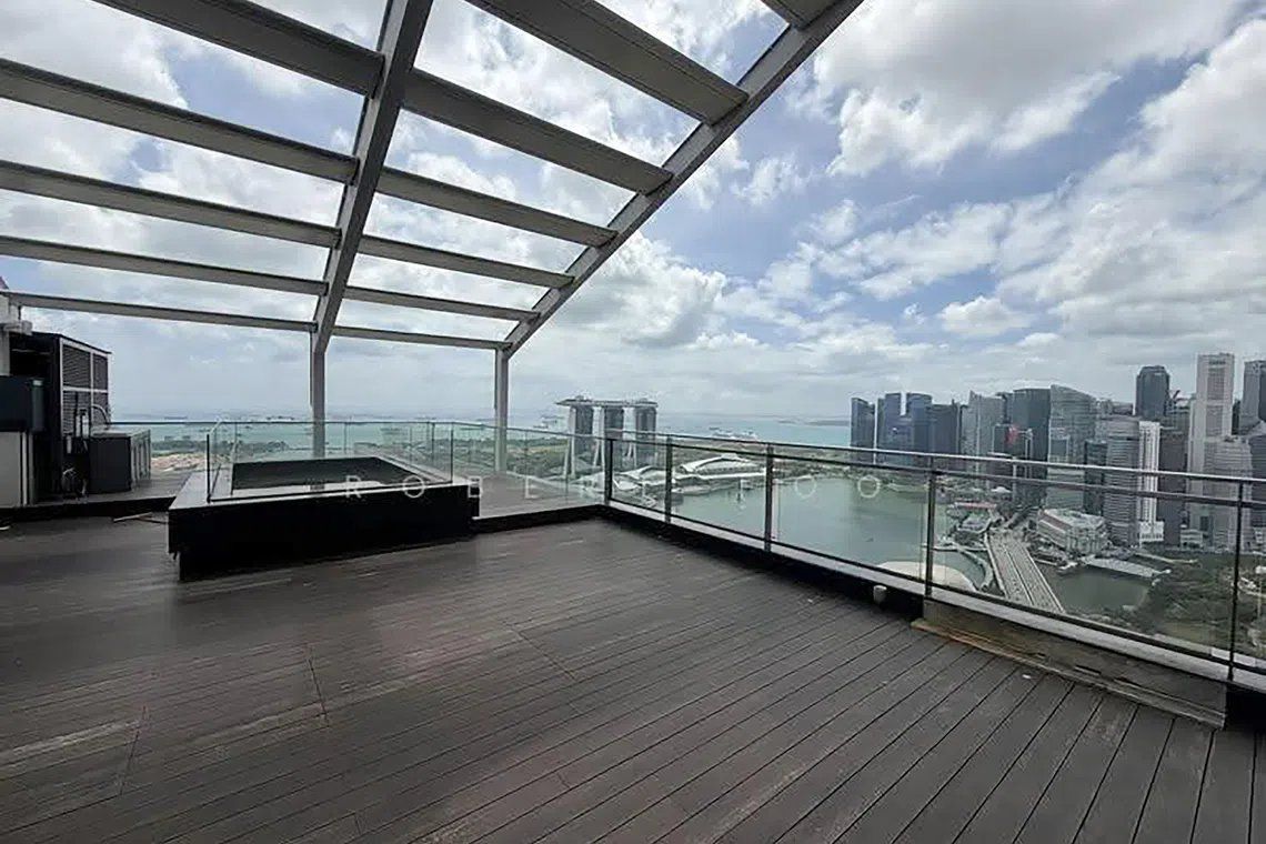 Su’s 6,727 sq ft penthouse comes with a massive open balcony overlooking the Esplanade and Marina Bay. - Photo: ETC
