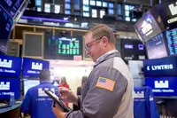 Wall St futures slip as rising oil, Treasury yields compound AI anxiety