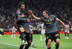 Soccer-Inter rally past Udinese to stay level with Roma at Serie A summit