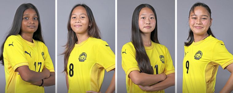 Making Malaysia’s day: (from left) National Under-17 women’s football team players A. Danushri, Nina Hasmaji, Lim You and Keisha Adeliena Khalid.