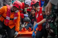 Families desperate for news as 129 still missing four days after capsize of ship in Indonesia's Java Sea