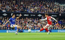 Soccer-Teenager Dowman scores twice as Arsenal progress in League Cup