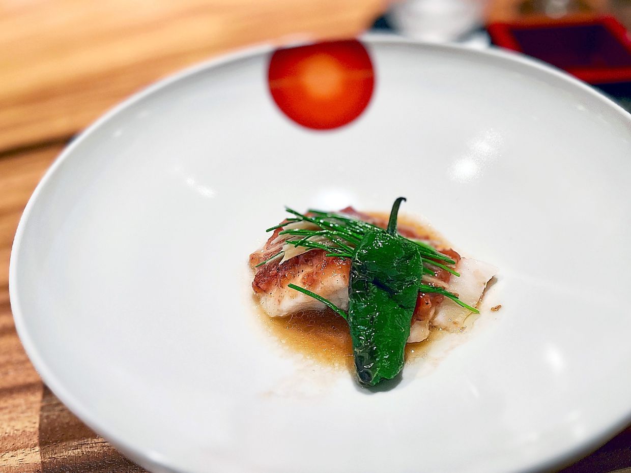 The Chilean Seabass Moromi Miso is glazed in yuzu soy and drizzled with sesame oil.