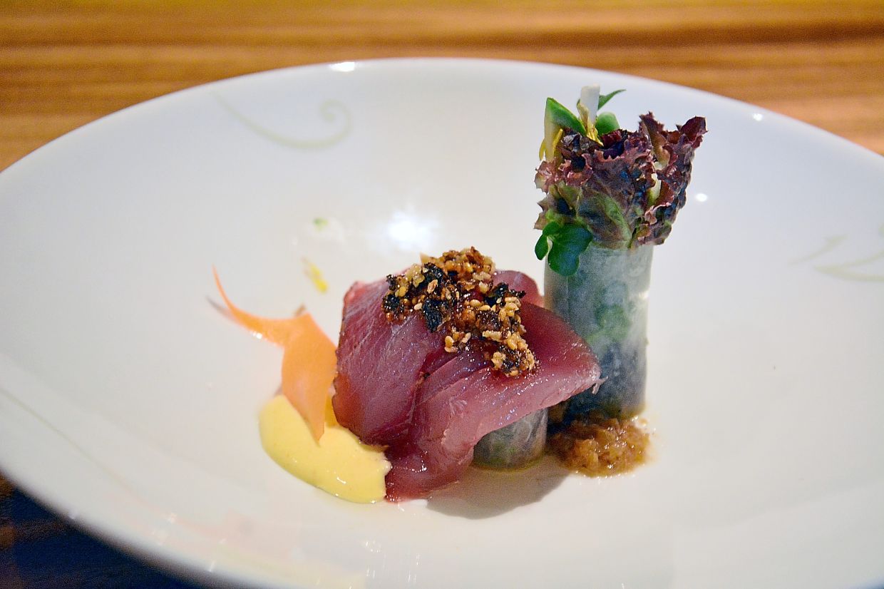 Katsuo Sashimi Salad features fresh ‘katsuo’ layered with ‘daikon’, avocado, mushrooms and carrots.