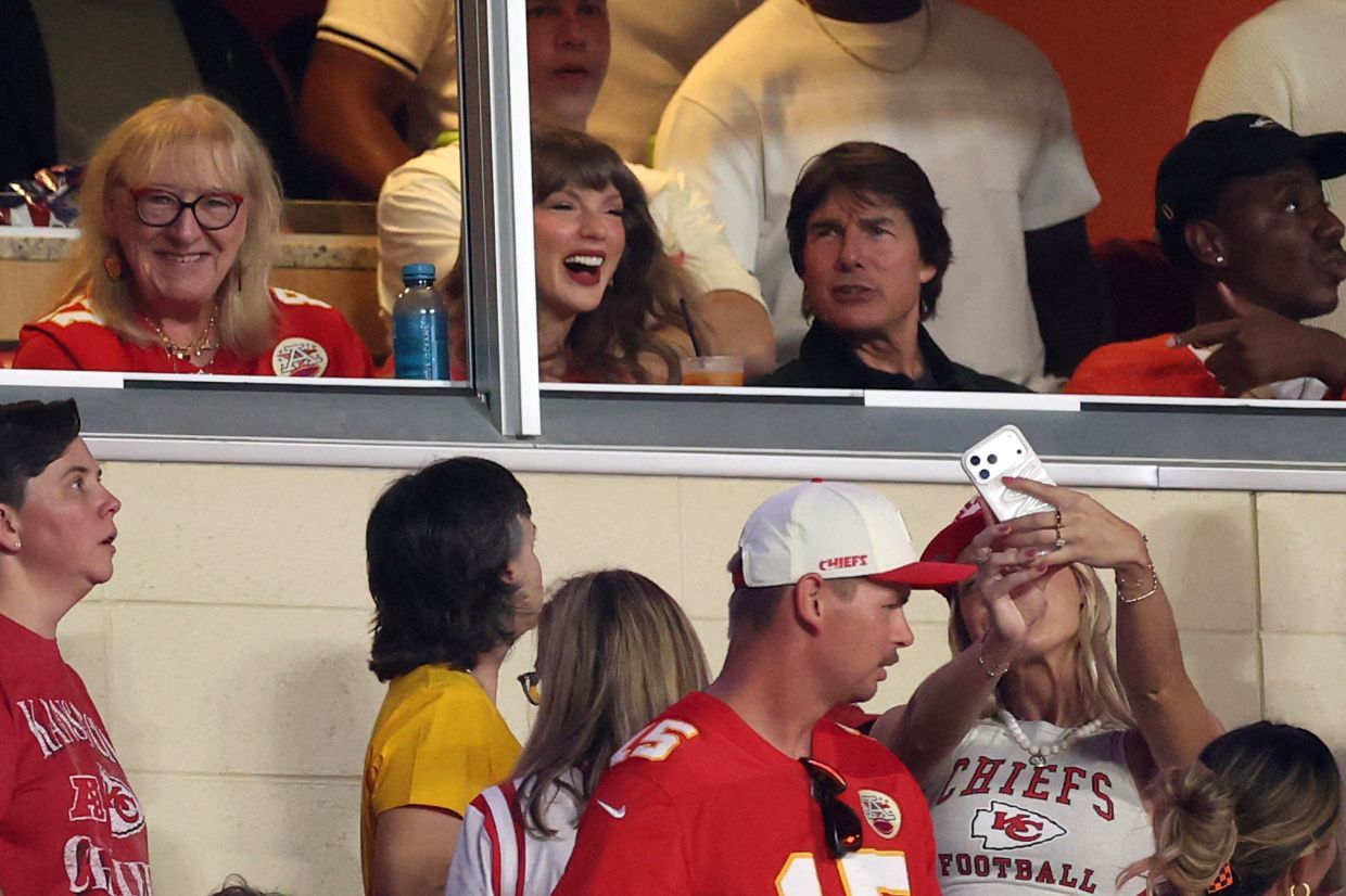 (From left) Donna Kelce, Taylor Swift and Tom Cruise attend the game between the Kansas City Chiefs and the Denver Broncos at Arrowhead Stadium on Sept 14. Photo: AFP