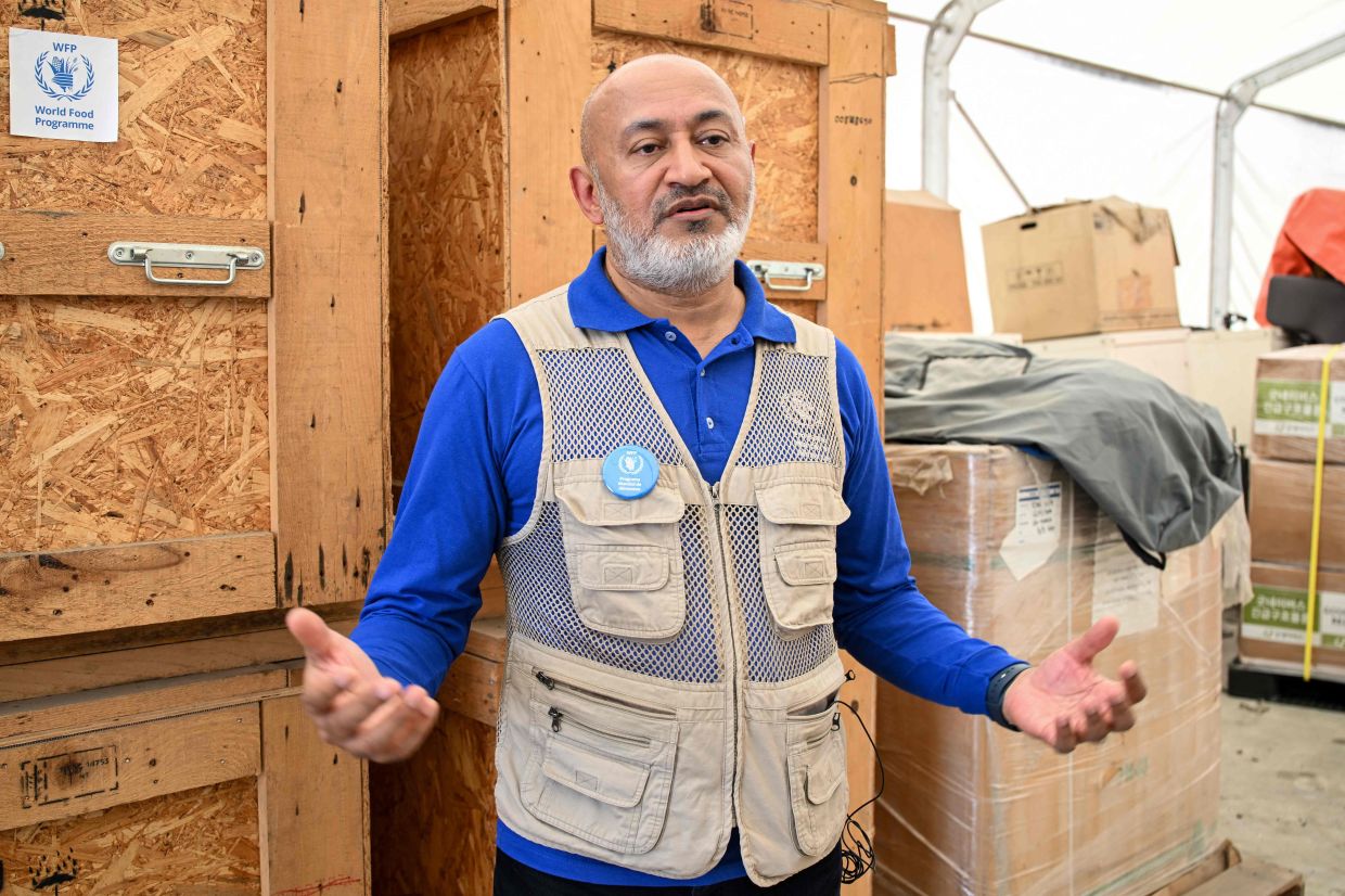 United Nations World Food Programme Nepal Country's Director Riaz Lodhi speaking about emergency relief supplies for flash flood victims during an interview with AFP at Tribhuvan International Airport's cargo area in Kathmandu on Sept 17, 2026. - AFP