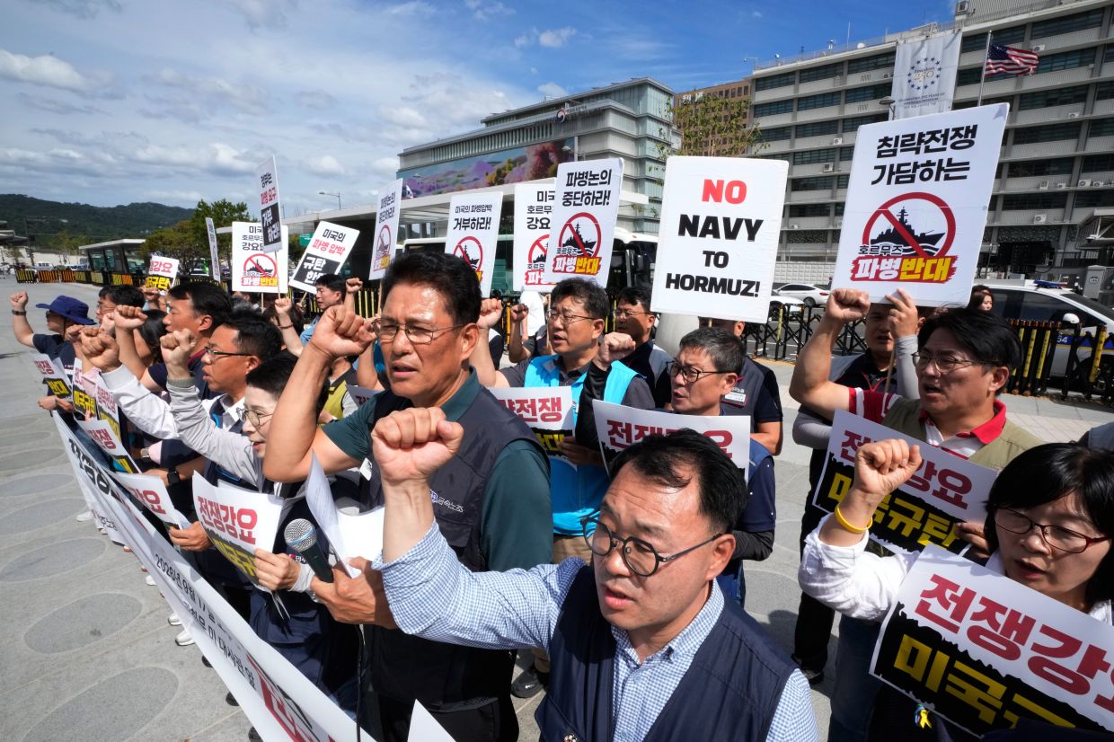 Protesters staging a rally against the possible deployment of South Korean troops to the Strait of Hormuz and a US demand for the deployment, near the US. Embassy in Seoul, South Korea, on Sept 17, 2026. The banners read ''Oppose troop deployment.'' - AP 