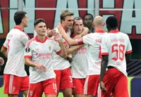 Soccer-Benfica earn win in Milan as Sunderland celebrate historic night