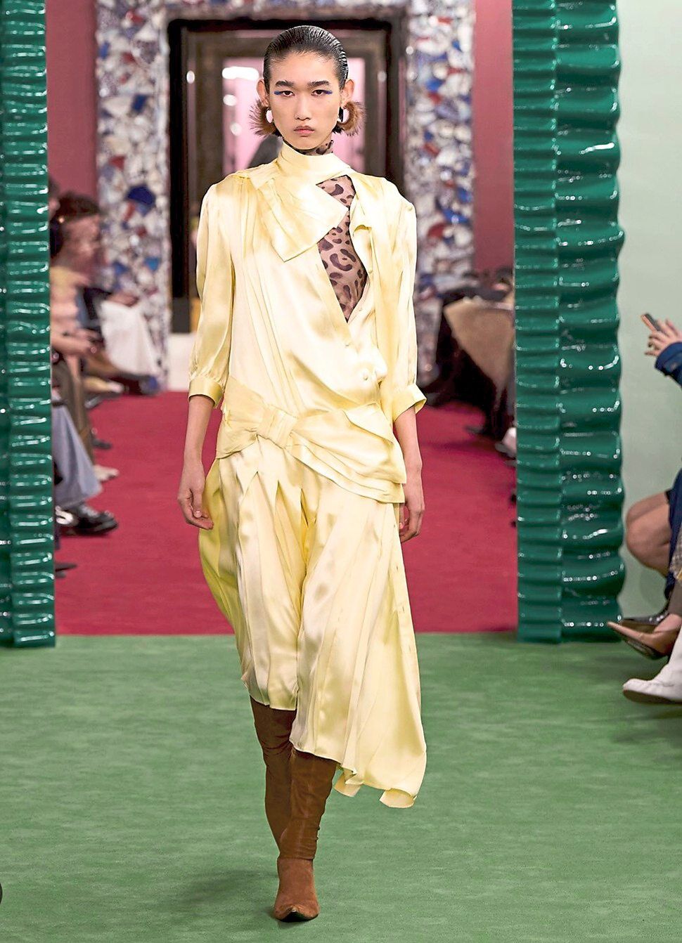Sweet meets savage where a yellow drop-waist silk dress features a cut-out to reveal a leopard print bodysuit underneath. Photo: Acne Studios