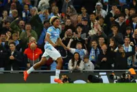 Soccer-Teenager Samba strikes twice on debut as Man City thrash Norwich in League Cup