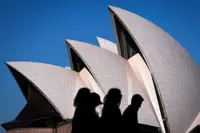Australia to detain tourists who overstay visa, minister says