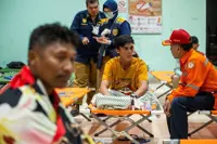 Indonesia begins operation to right capsized ship in Java Sea as 129 remain missing