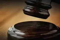 ‘Datuk Seri’ jailed 14 months, caned for cheating director over AED project