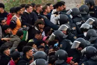 Spanish police launch operation to clear Ceuta migrants off beach