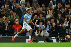 Soccer-Teenager Samba strikes twice on debut as Man City thrash Norwich in League Cup