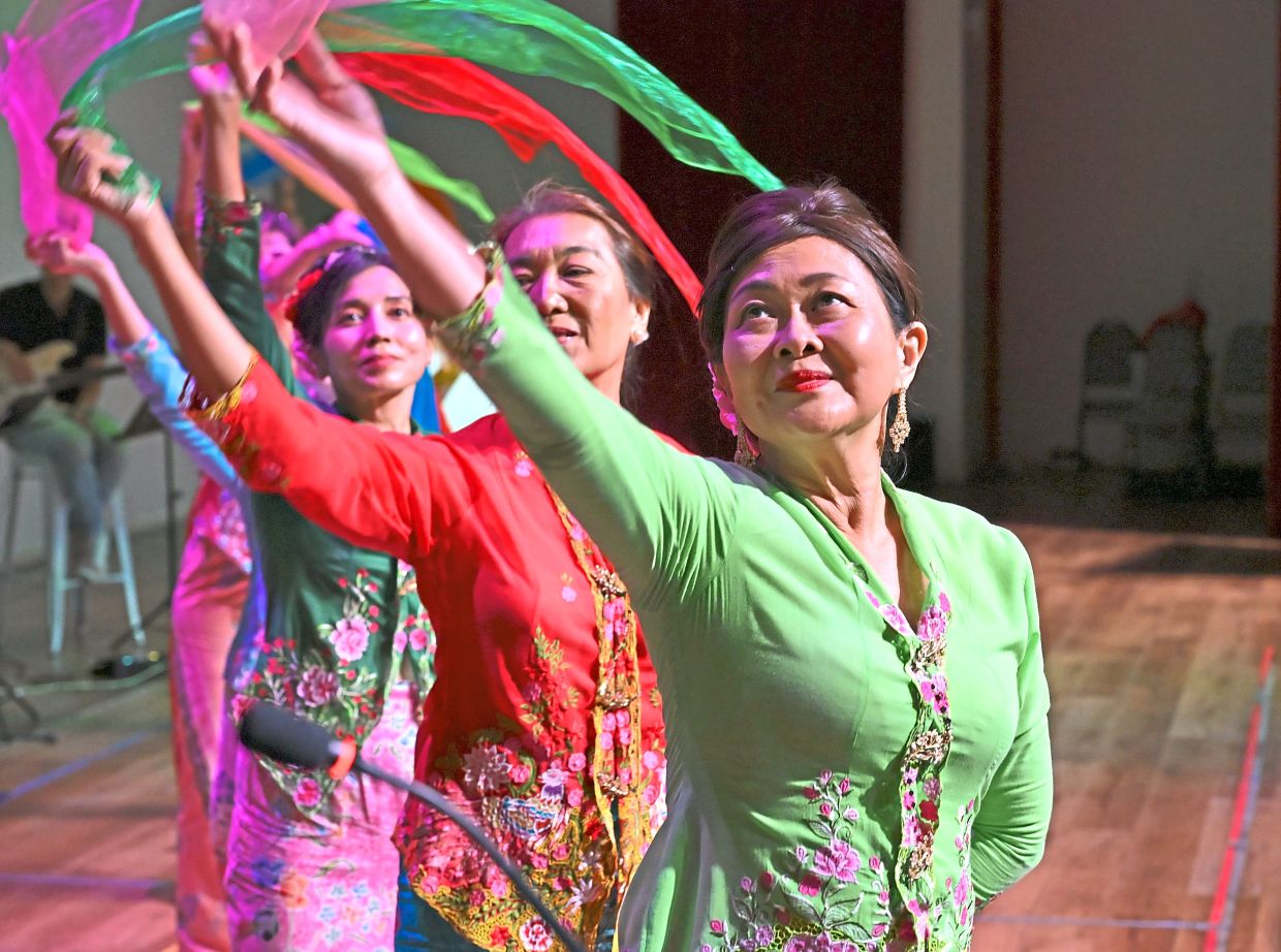 Performers delivering a vibrant Nyonya dance.