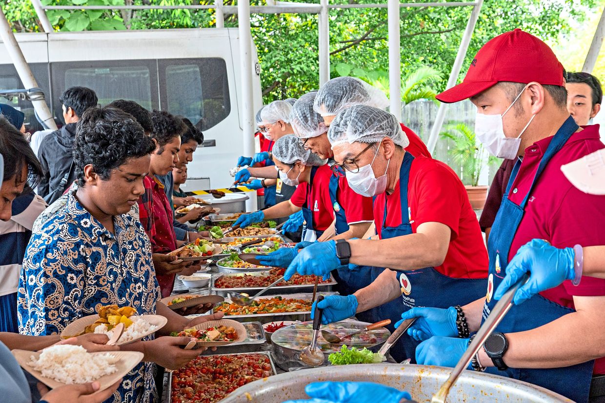 Community members enjoying food at the event. — Photos: Handout