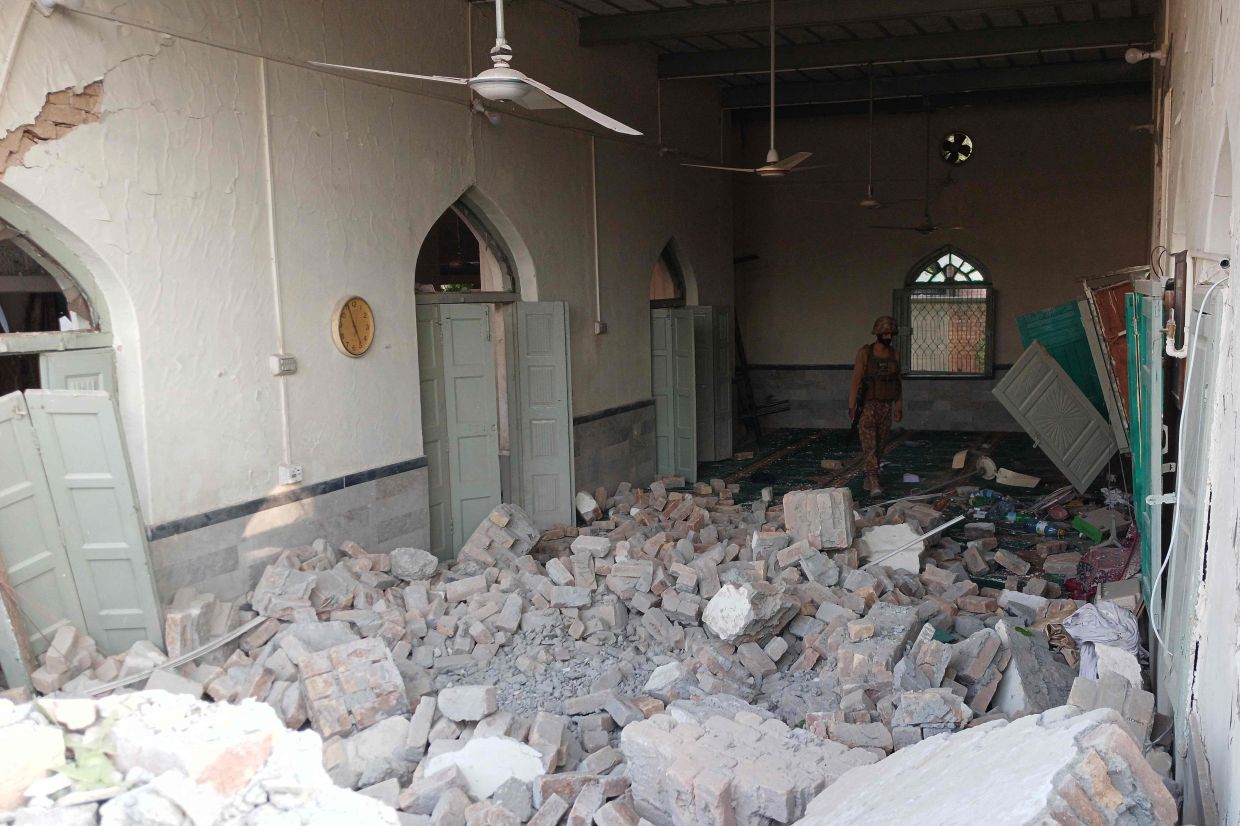 An army personnel walks amid the rubble following an explosion inside the police headquarters at Kohat in Pakistan's Khyber Pakhtunkhwa province on Sept 18, 2026. An explosion at a historic police headquarters in northern Pakistan on Sept 18 killed at least eight people and wounded 35 more, officials said, with the country's president swiftly blaming a militant group. - Photo: AFP