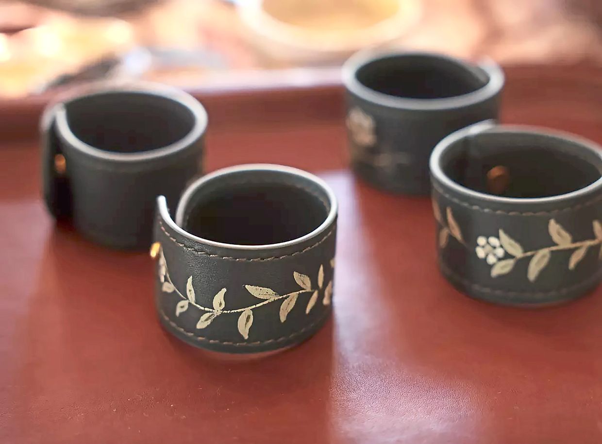 Leather napkin rings Saleh has painted for Nathan Turner.