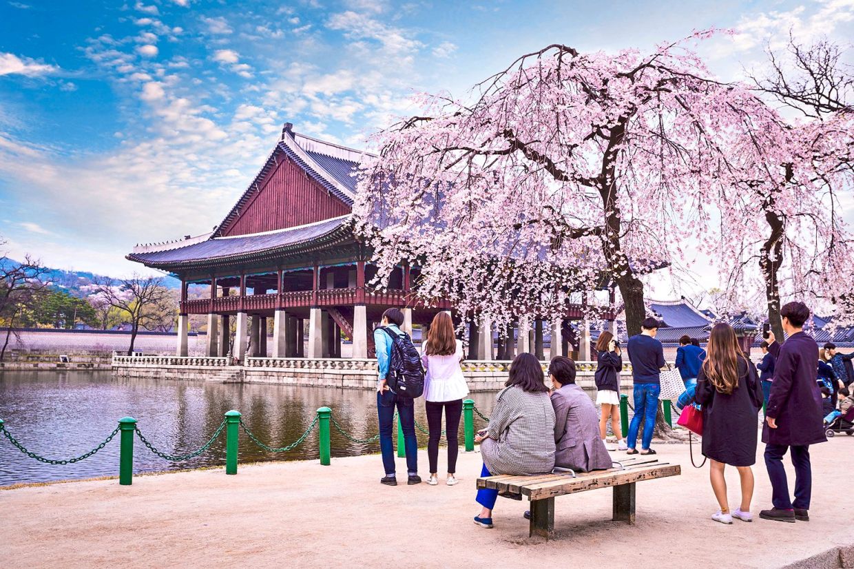 Tourists visiting Gyeongbokgung Palace in in Seoul, which is famous in today's pop culture. This has influenced young people's vocabulary. A young Malaysian might use a very Malaysian expression in one sentence and then incorporate Internet slang or Korean expressions.