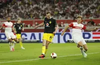 Soccer-Dortmund beat Stuttgart 1-0 to go top of Bundesliga