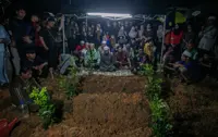 Three family members killed in Tambun fire laid to rest in same grave