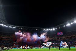 Soccer-Ligue 1 clash briefly halted after Lyon fans unveil offensive banner