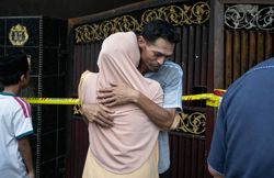 Son could only hold mother's hand through balcony grilles as she perishes in fire