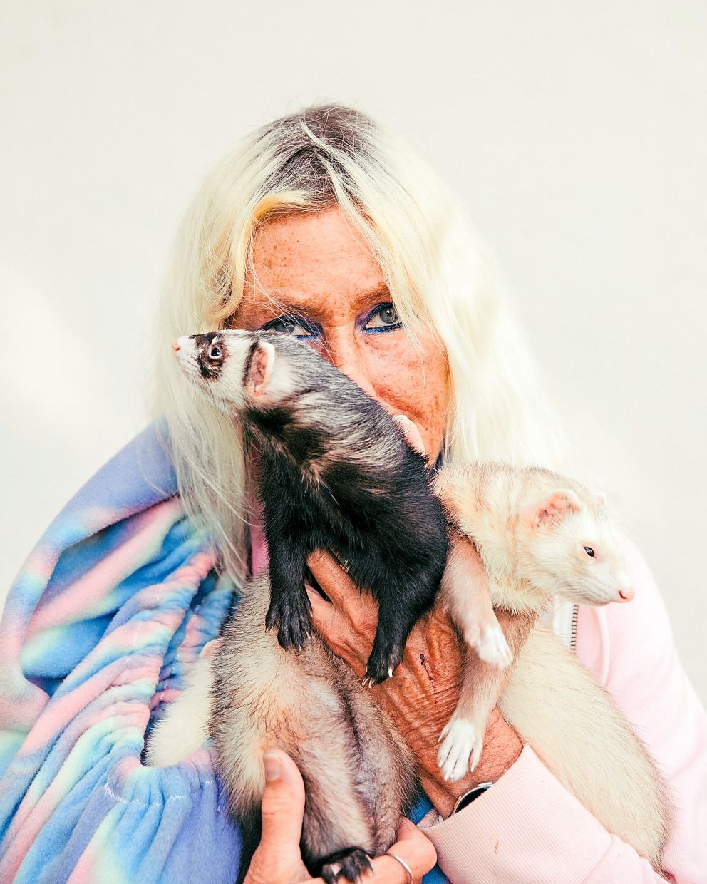 Dixie Wallace holding two ferrets. She brought seven of her 14 ferrets to the bash.