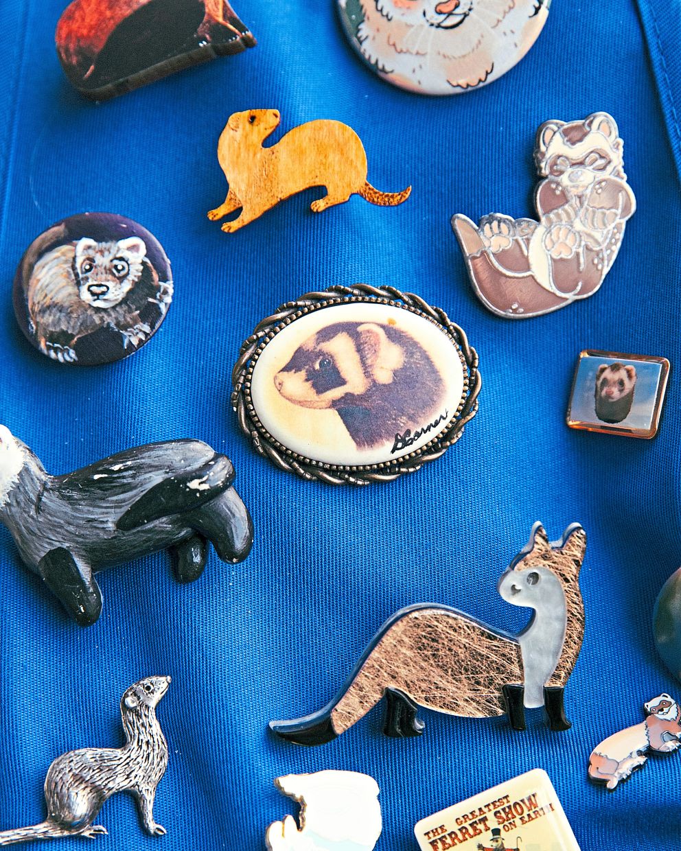 Pam VanOverloop shows her ferret-themed pin collection.