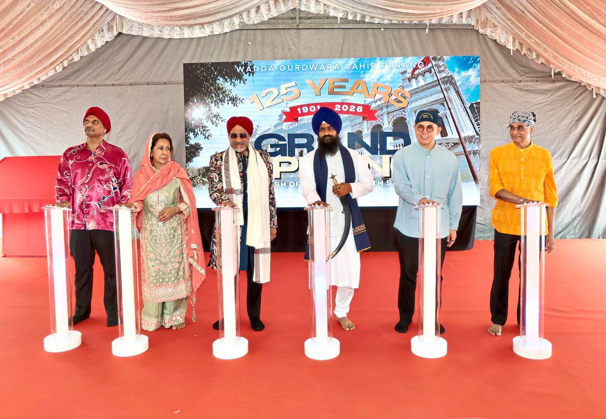 (From third left) Jagdeep, Kuldeep and Sim at the reopening of the restored Wadda Gurdwara Sahib Penang.
