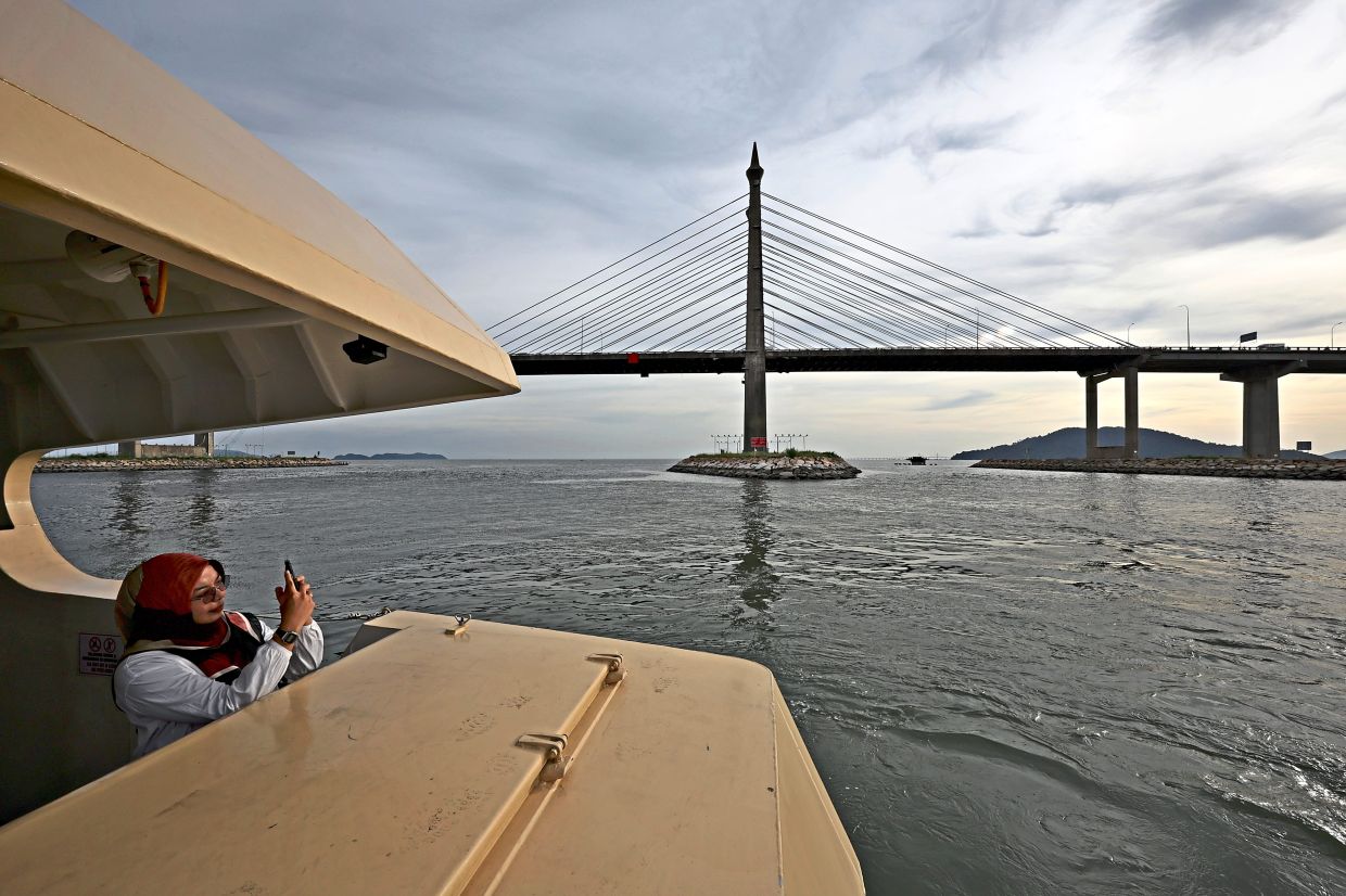 Sunset cruises in Penang would typically take guests past the Penang Bridge. — CHAN BOON KAI/The Star
