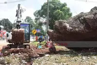 Giant boulder rolls down mountain in Myanmar's Shan State, damaging building and two vehicles