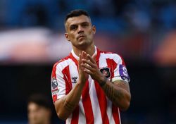 Soccer-Swiss captain Xhaka sidelined over fake COVID certificate