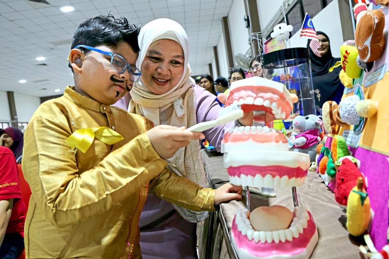 Rais and his mother Nor Aishah at the Kids Day Out 2026 outing.
