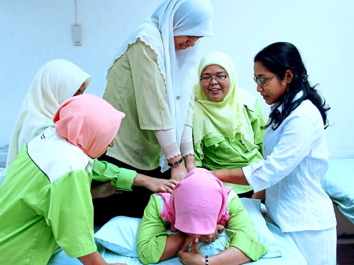 Trainees at Malaysia Association for the Blind’s Gurney Training Centre gain massage therapy skills to help them pursue employment opportunities. Photo: Filepic