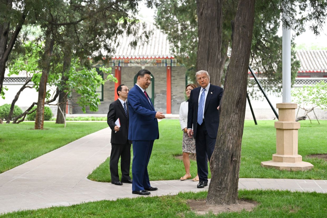 Chinese President Xi Jinping welcomes US President Donald Trump upon Trump's arrival at Zhongnanhai in Beijing, capital of China, May 15, 2026. — Xinhua/Li Xiang