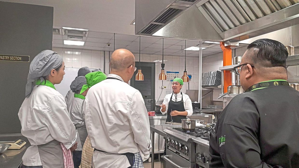 Because the traditional methods of making Peranakan cuisine are fast dying out, De Souza teaches culinary students how Baba Nyonya dishes are meant to be made. — SHARON DE SOUZA