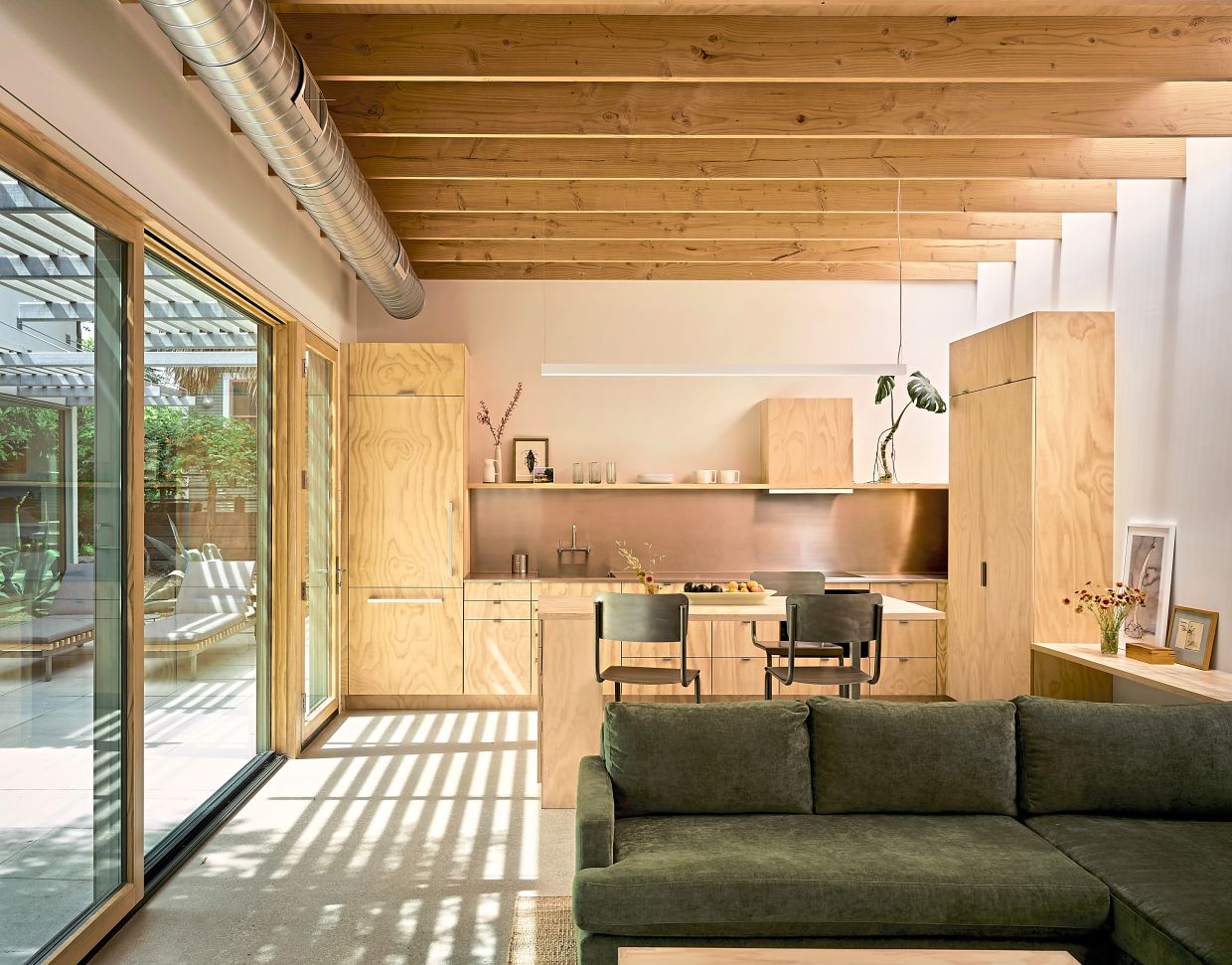 The living unit, which is separated from a stand-alone art studio by a patio.