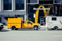 McDonald’s tests placing ads for other brands on menu screens