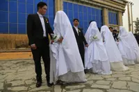 Afghan couples tie knot in mass ceremony to cut costs