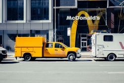 McDonald’s tests placing ads for other brands on menu screens