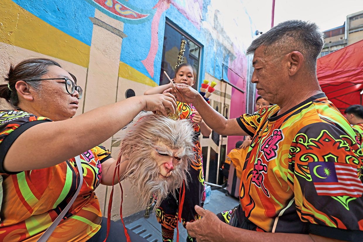 Final touches being made to a mask of the Monkey King.